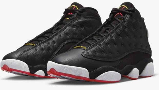 View of black, white, and red Air Jordan shoes.